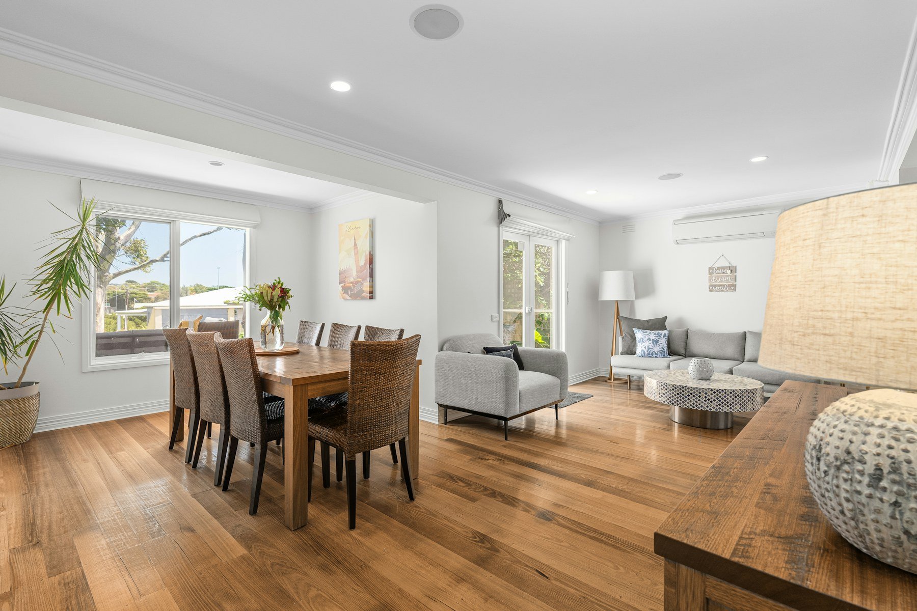 Finished living room with warm hardwood flooring