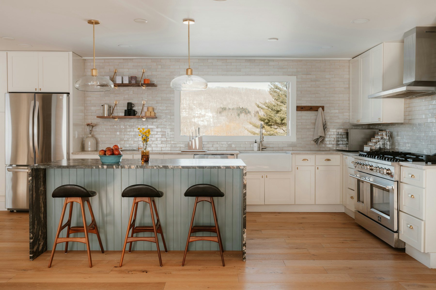 Modern kitchen with warm wood flooring